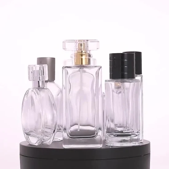 Precio de fábrica Botella de vidrio de perfume redonda de hermoso diseño en botella de perfume de 50 ml Botella de embalaje cosmético de vidrio Fabricantes